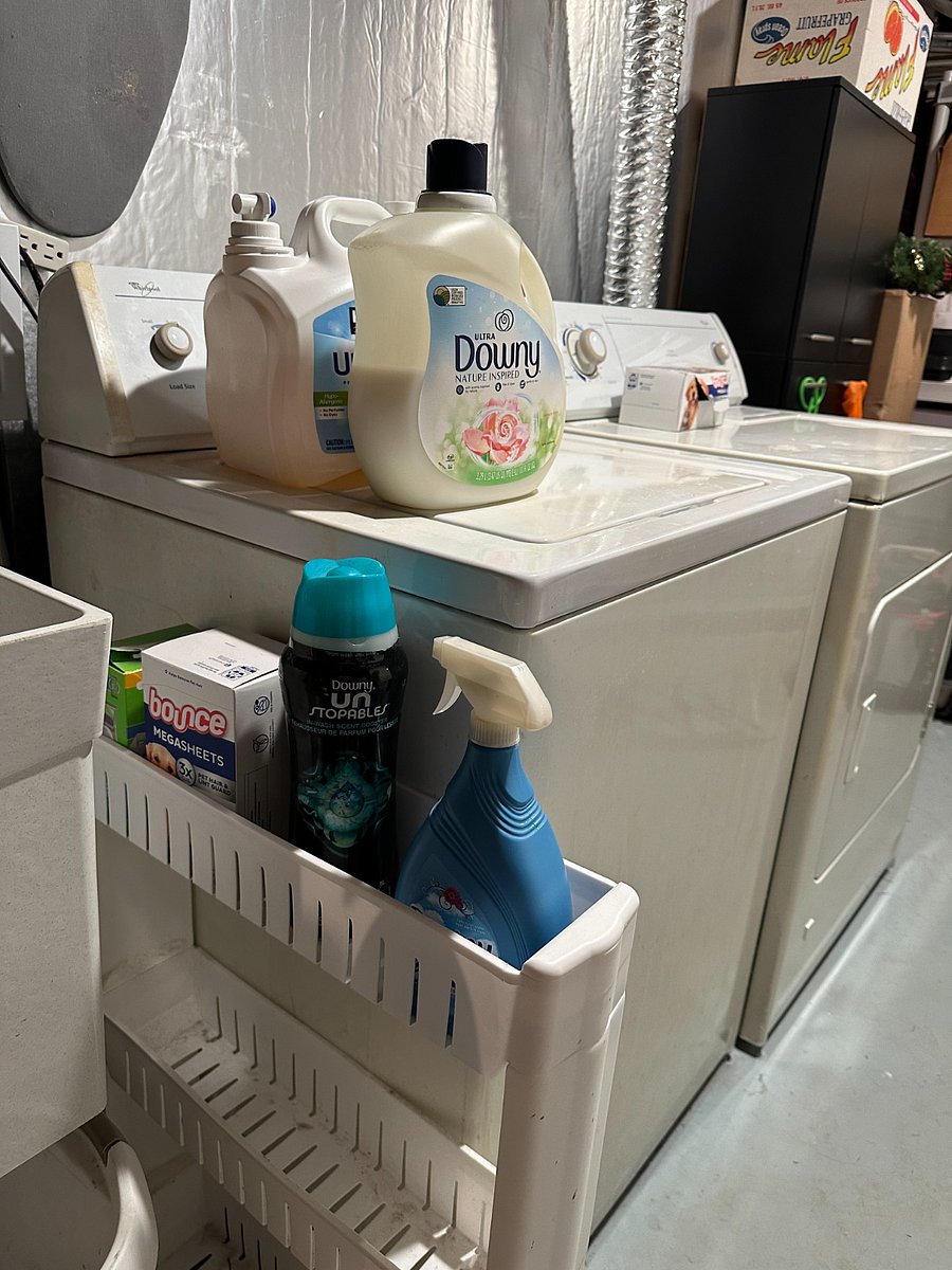 Washer and dryer in basement, products available for use