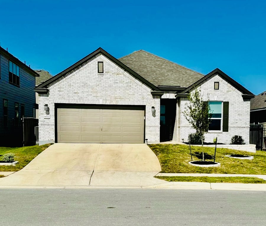 Exterior of home - across from the park! Two-car garage and plenty of parking in your double driveway