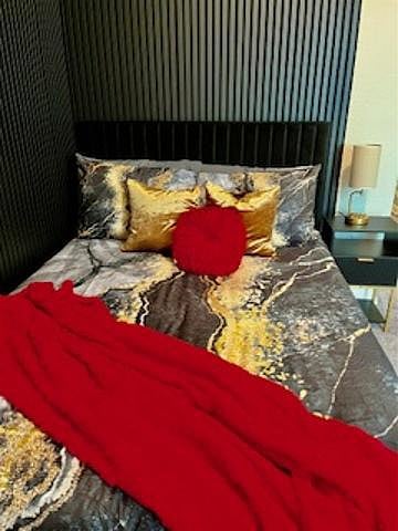 Guestroom One features a Full bed with nightstand, long dresser, large walk-in closet, and lamp with USB, plug
