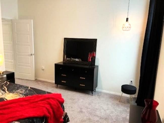 long dresser and mirror in Guestroom one Bedroom