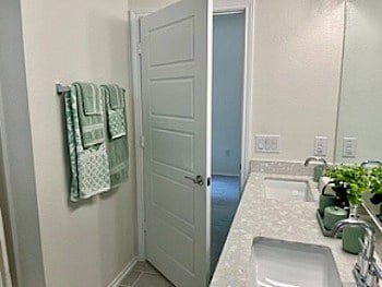 2nd Full bath in guest wing features double sinks and tub/shower combination