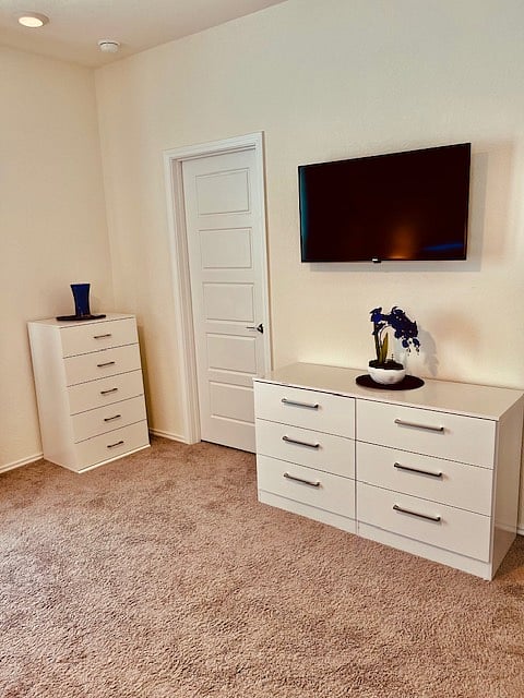 Two new dressers alongside of huge Master walk-in closet