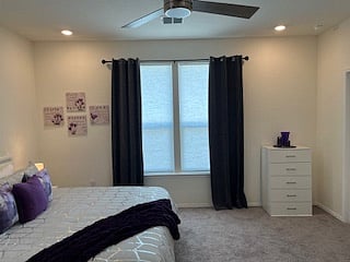 view of Masterbedroom from Master bath, two large windows in the bedroom, one in the bath
