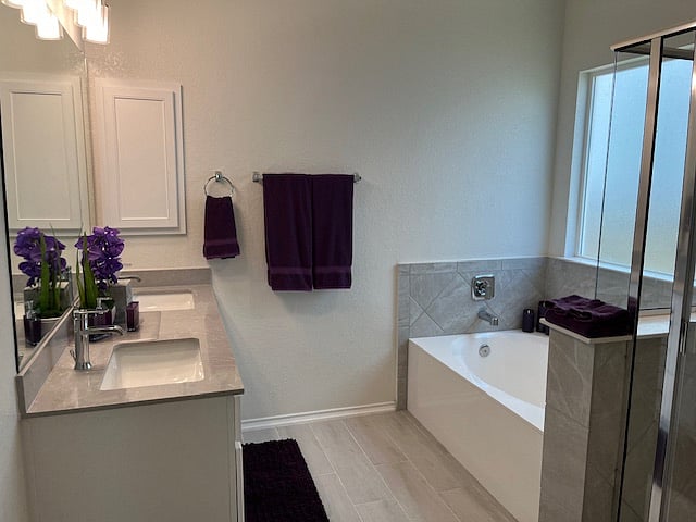 Master bath features large soaker tub, seperate shower, private toilet closet, double sinks
