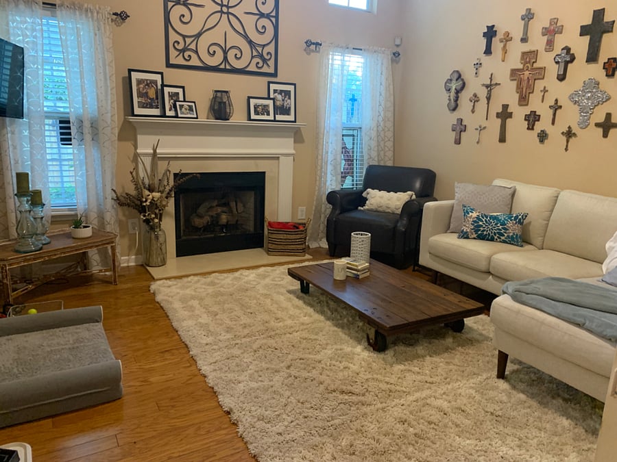 Living area in the back of the house with fireplace.