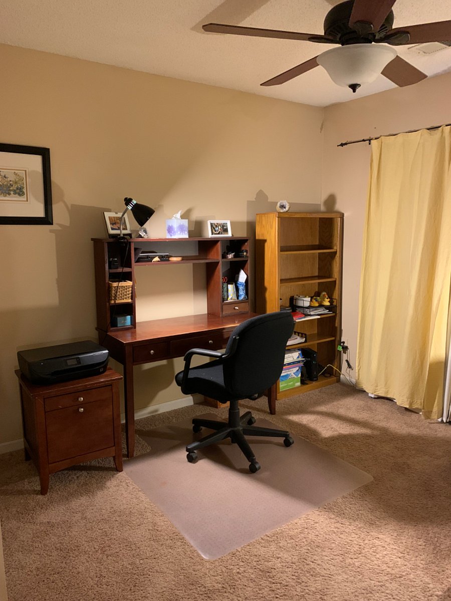 Upstairs Loft with desk, office chair, printer, bookshelf and comfortable chair and matching ottoman. Ceiling fan with remote. Can be a dedicated office space or used for yoga/exercise.