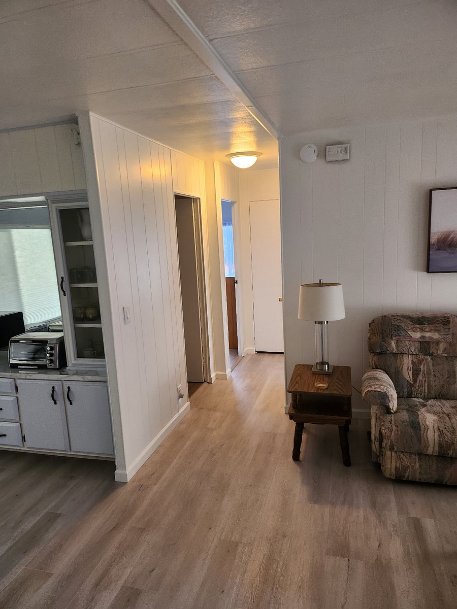 Hallway toward bathroom and 2 bedrooms as well as 2 hall closets