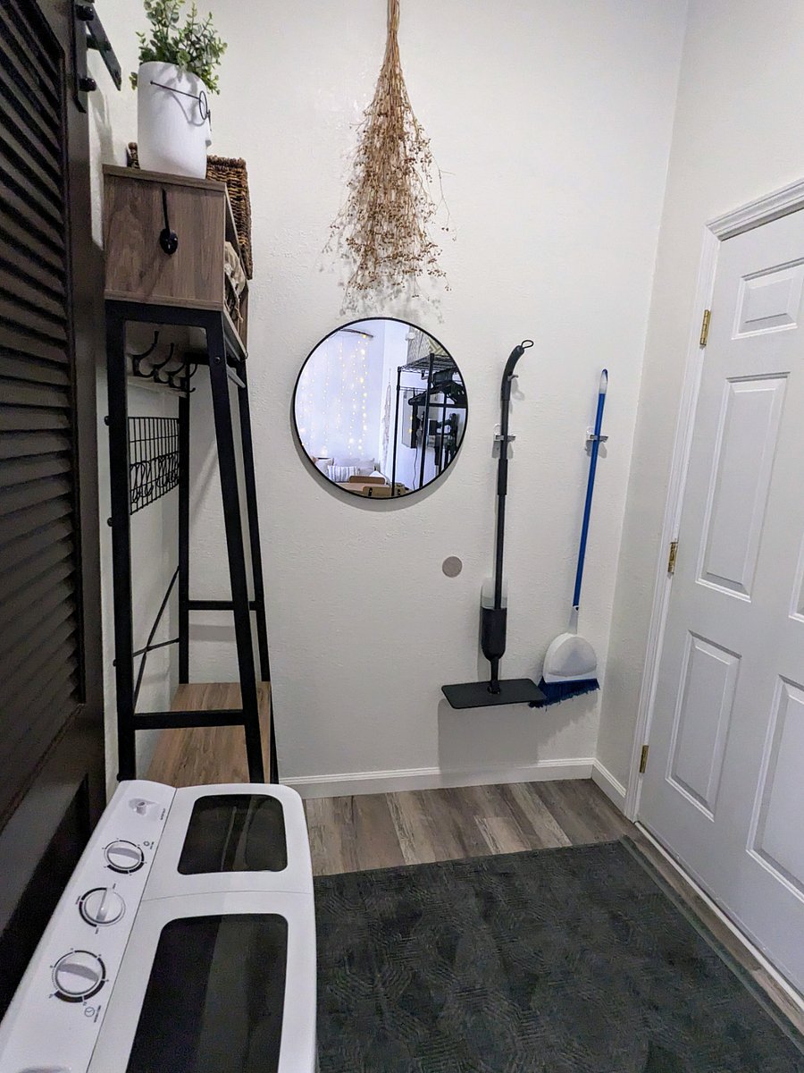 Handy mop & broom makeup quick cleanups a breeze! There's also a handy cordless vacuum mounted next to the wardrobe.
