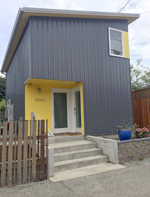Entry is the left door. Right door goes to the lower unit, an Airbnb rental.