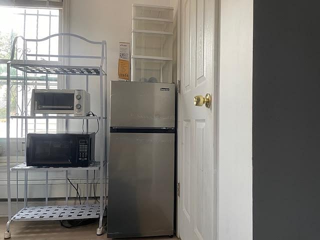 Toaster oven, microwave, coffee maker, food storage and fire extinguisher.