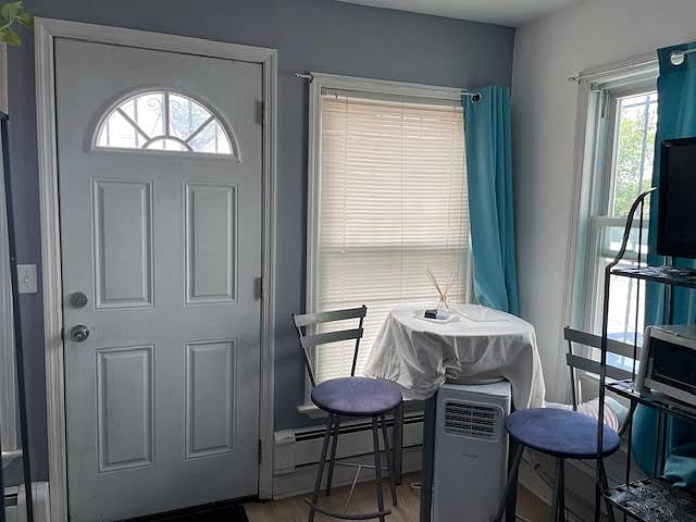 Cozy breakfast nook with portable air conditioning placed to maximize space.