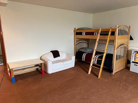 Bunk bed in downstairs bed with fold-out couch for kids