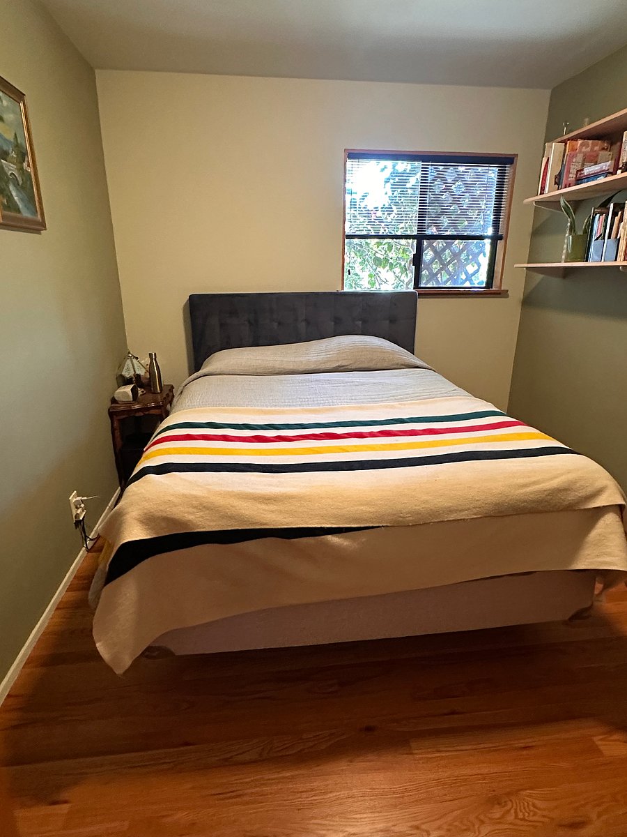 Smaller guest bedroom with 6 foot wide closet.