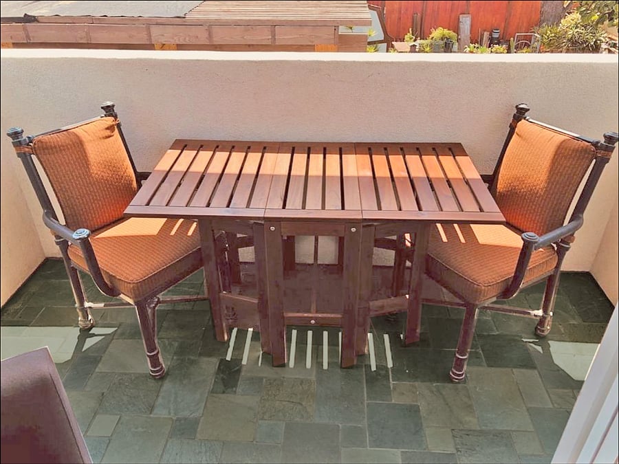 Balcony overlooks rear deck, outdoor kitchen and garden.