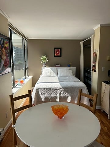 Bed frame has drawers below the mattress for extra storage, and headboard has shelves.