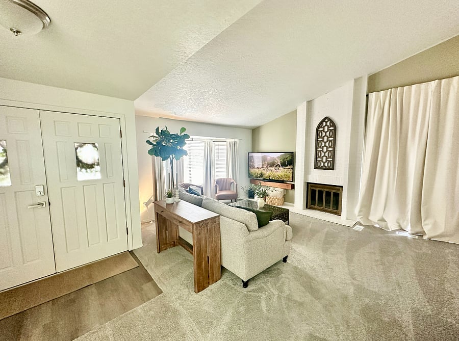 Cozy living room with a fireplace and 60 smart TV