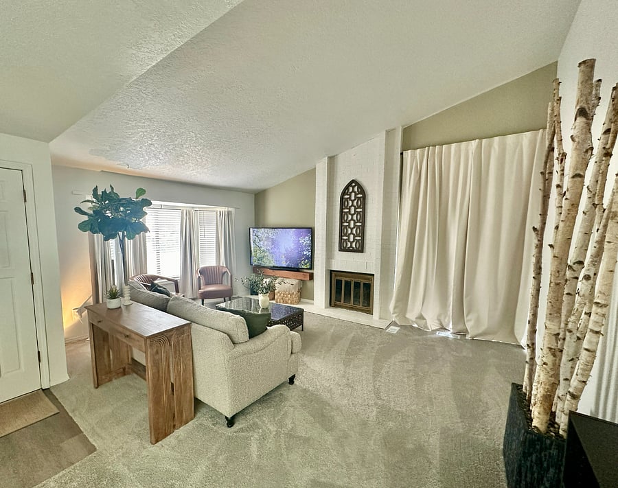 Cozy living room with a fireplace and 60 smart TV