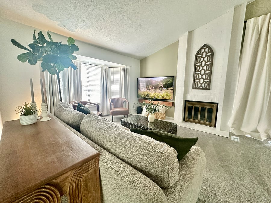 Cozy living room with a fireplace and 60 smart TV