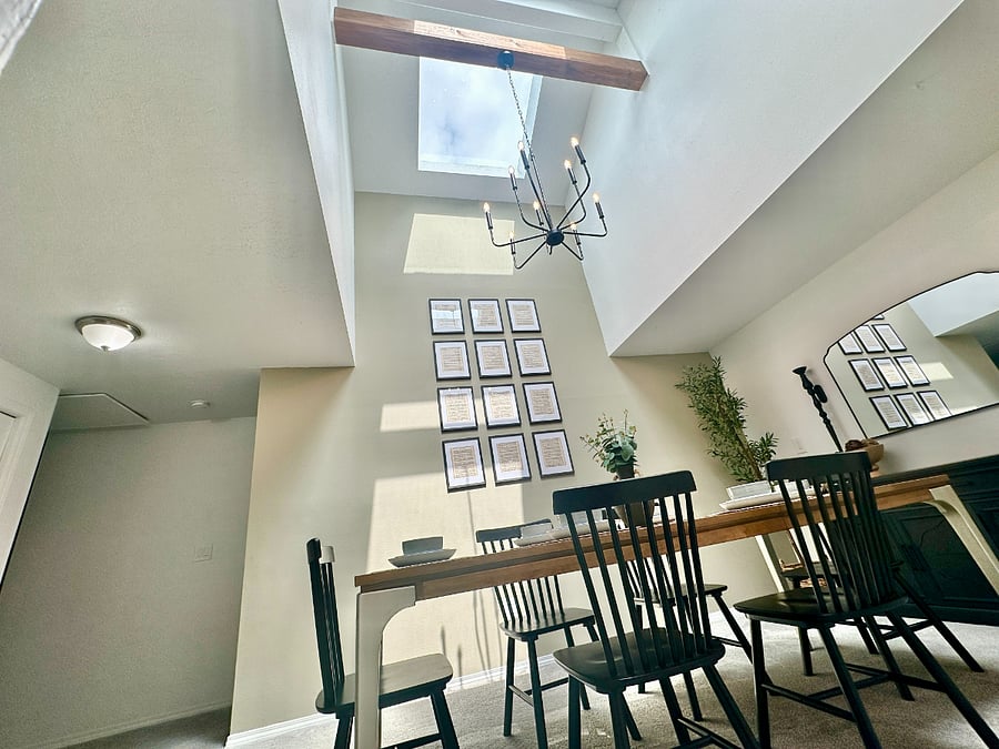 Beautifully lit dining room with tall ceilings, thanks to brand new skylights!