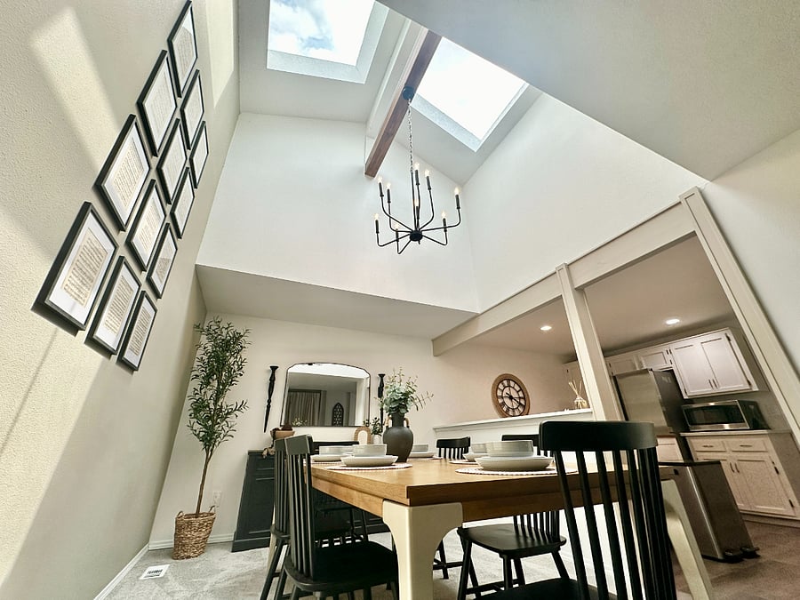 Beautifully lit dining room with tall ceilings, thanks to brand new skylights!
