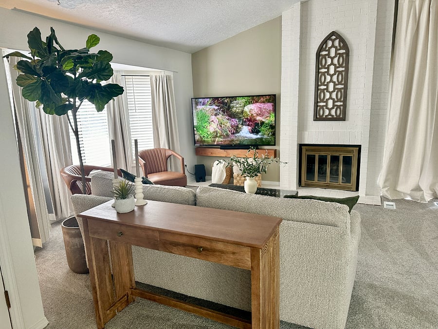 Cozy living room with a fireplace and 60 smart TV