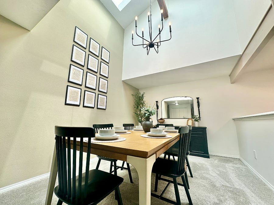 Beautifully lit dining room with tall ceilings, thanks to brand new skylights!