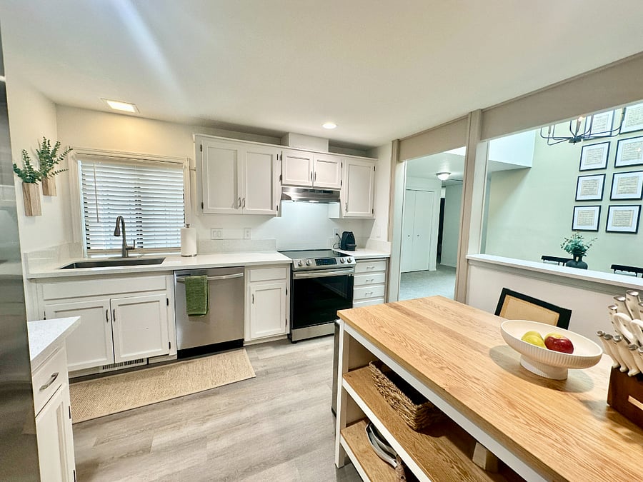 Fully equipped kitchen with all you need to get cooking! Brand-new stainless-steel appliances and a handy kitchen island with stools.