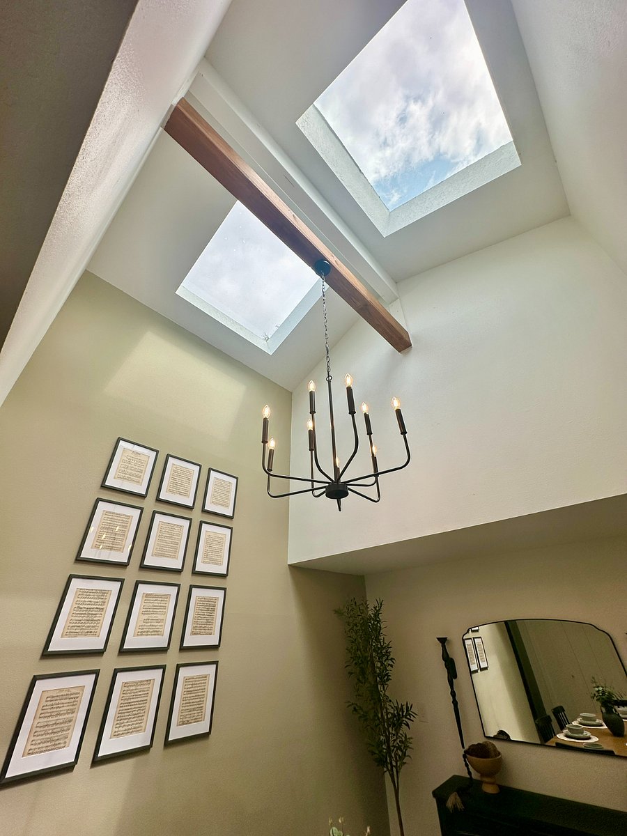 Beautifully lit dining room with tall ceilings, thanks to brand new skylights!