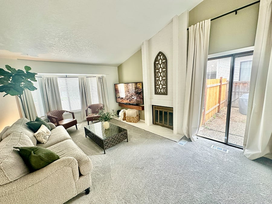 Cozy living room with a fireplace and 60 smart TV