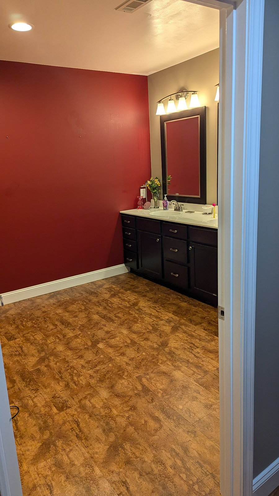 Entrance to large bathroom with dual vanity