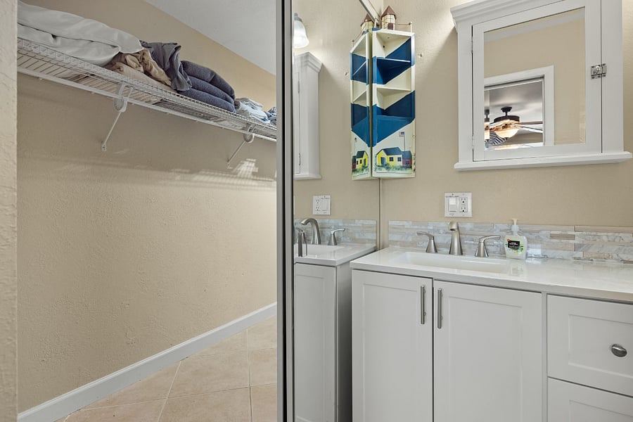 Master bath opens to large walk in closet with washer and dryer