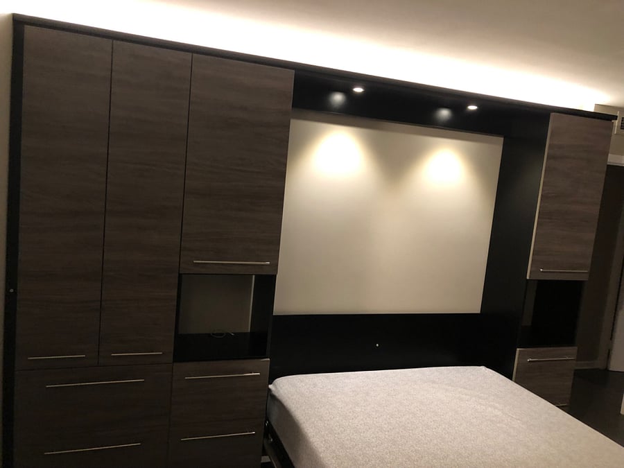 Main Bedroom - Queen Size Murphy Bed, Memory Foam Mattress with side tables, light, and storage.