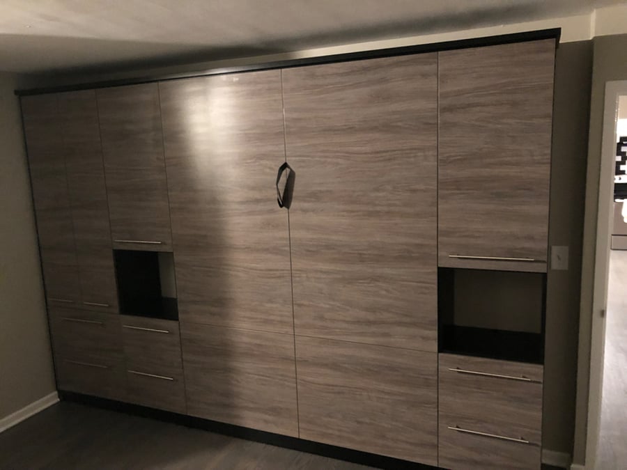Main Bedroom - Queen Size Murphy Bed, Memory Foam Mattress with side tables, light, and storage.