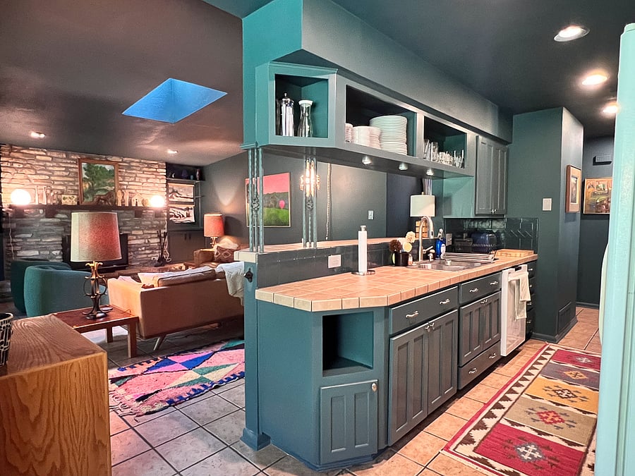 View of the Kitchen/living room/small desk area from the dinning area.