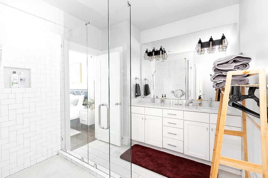 Master Bathroom with waterfall shower and dual sinks.