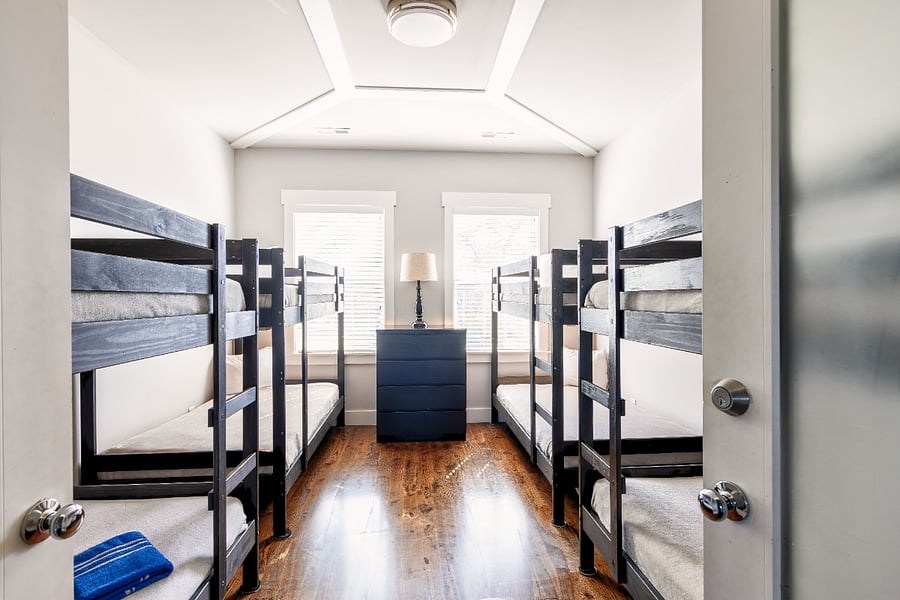 Bedroom 5 - Upstairs. 5 bedrooms and 12 total beds in this house. 3 FULL bathrooms. WE ARE ABLE TO ADD A QUEEN BED TO THIS ROOM AND REMOVE A BUNK IF REQUESTED.
