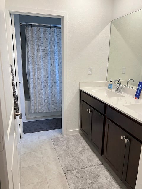 Upstairs Hall Bathroom with double sinks and tub/shower combo.