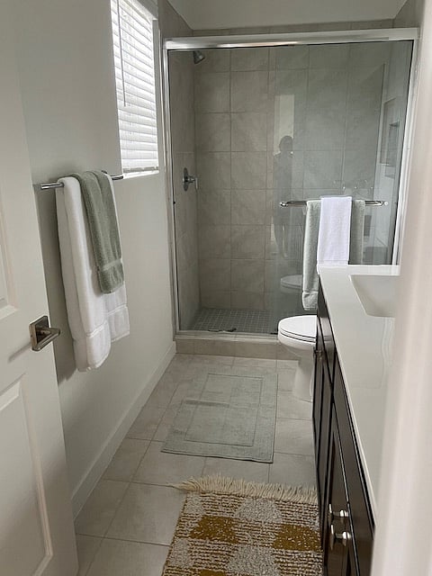 Primary bath with double sinks and walk in shower.
