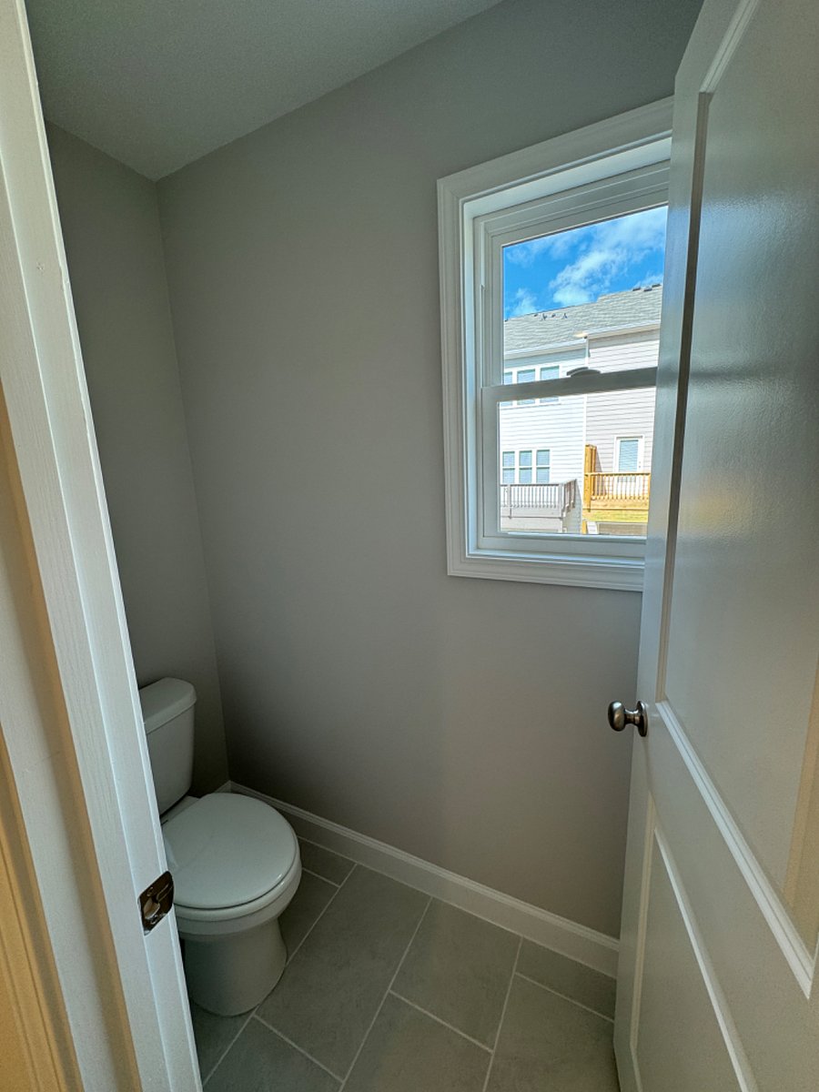 Water closet in master bathroom.