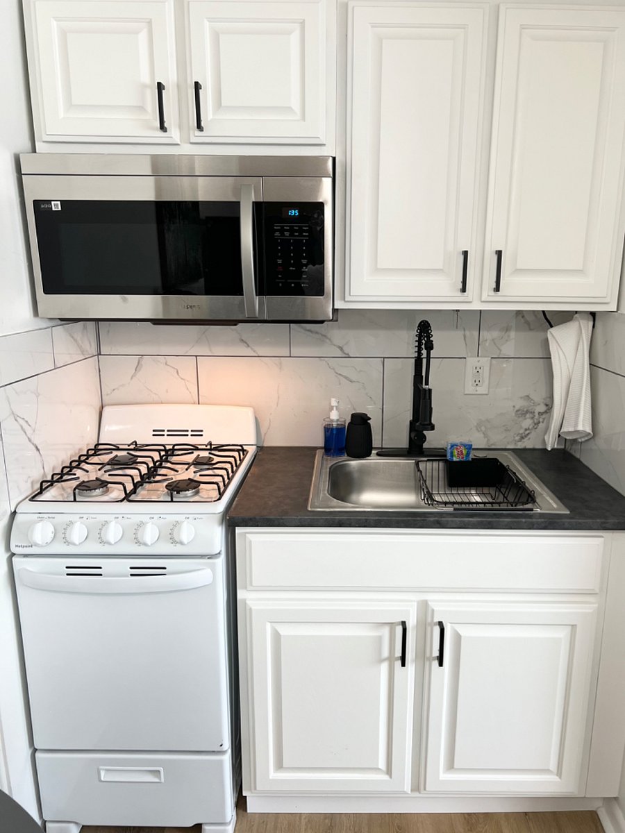 Gas stove, microwave and full sink.