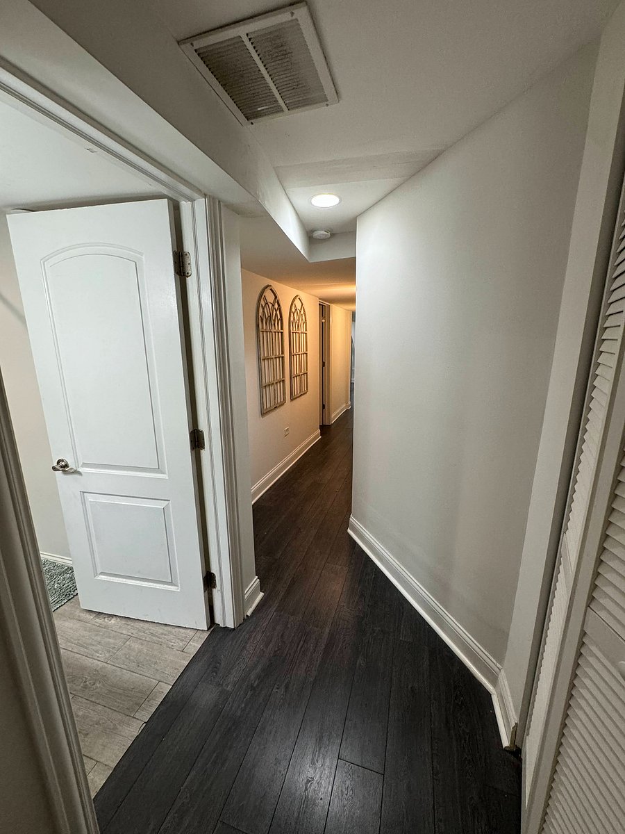 Hallway connection bath and bedrooms to living space