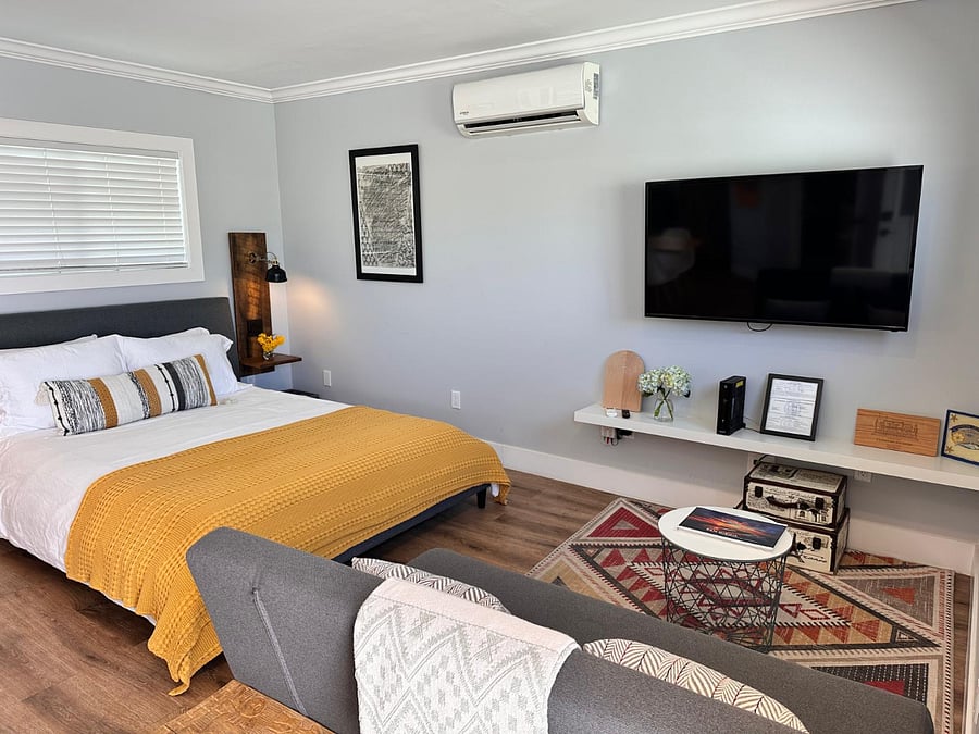 TV area with sofa bed and a swivel TV mount so that you can watch TV in bed