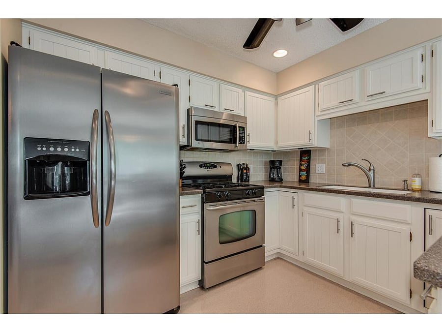 Full kitchen in the upstairs apartment, accessible upon request.