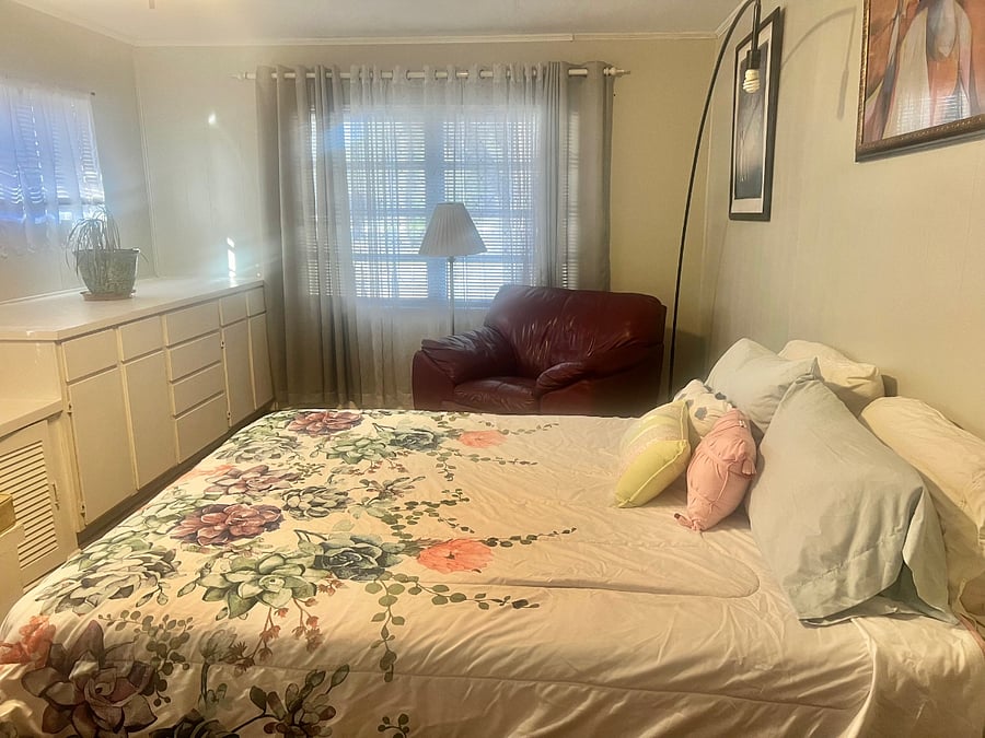 $1,175 a month. Full-Bath Mother-In-Law type Bedroom Suite, with full bathroom inside of suite, private combination lock, and a small private refrigerator inside of the suite.  Large closet, a large storage seating bin, and a large build in cabinet set..