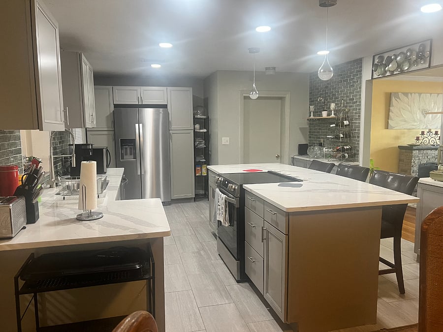 Remodeled Kitchen with marble island and counters, new stove,  refrigerator, and dishwasher.  Microwave, coffee maker, and toaster available.