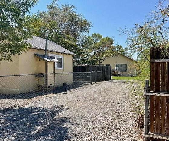 Your personal parking spot, view of main house behind privacy fence.