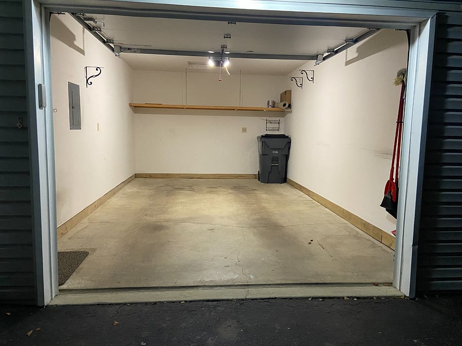 1 car garage with storage shelf