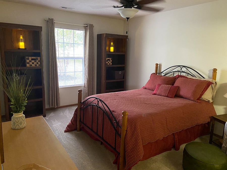 Bedroom suite #2 with baskets and shelves for clothes or storage