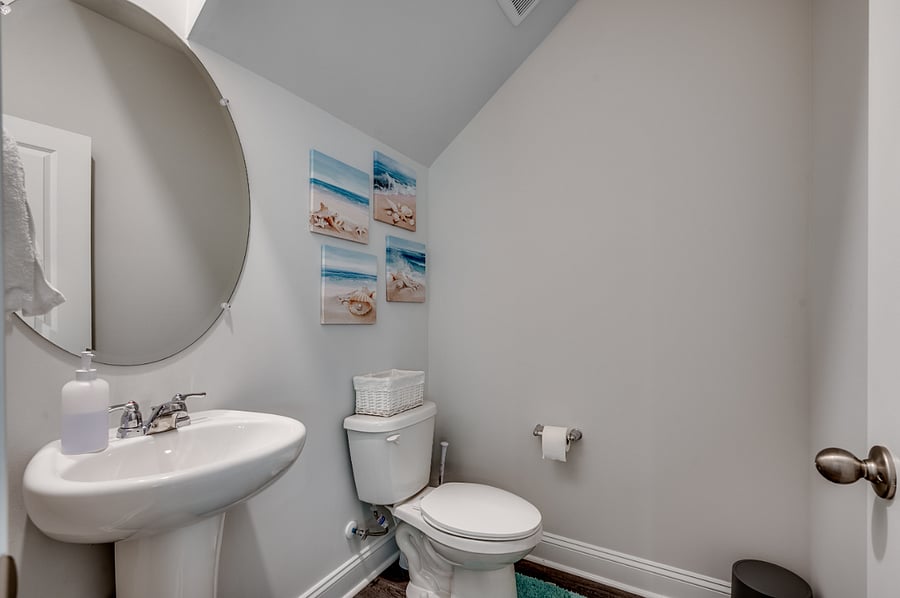 Stylish downstairs half bathroomperfect for guests and easy access from the main living areas.
