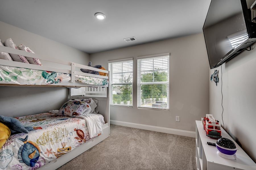 Fun third bedroom with bunk beds featuring full-size mattressesideal for kids or the young at heart. Plus, another huge smart TV for endless entertainment.